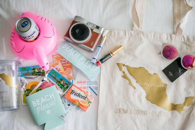 Welcome bag for destination wedding with sunglasses, camera and treats