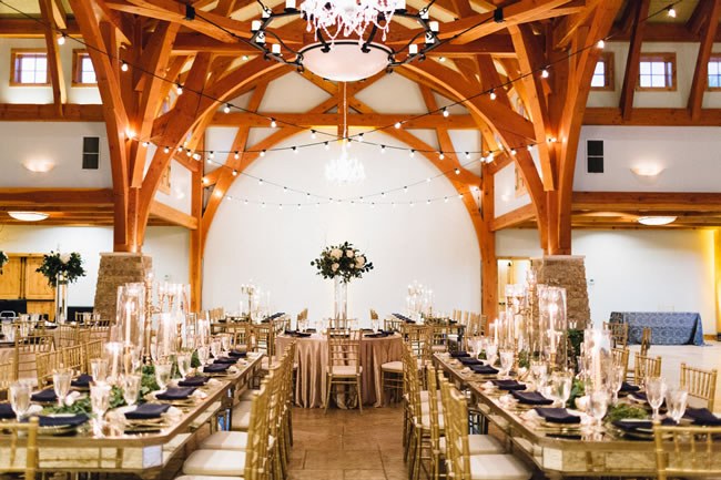 Wedding reception with beautiful wooden beams overhead at Camp Lucy in Texas