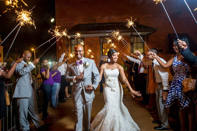 Newlyweds with a sparkler exit | How To Tip Your Wedding Vendors