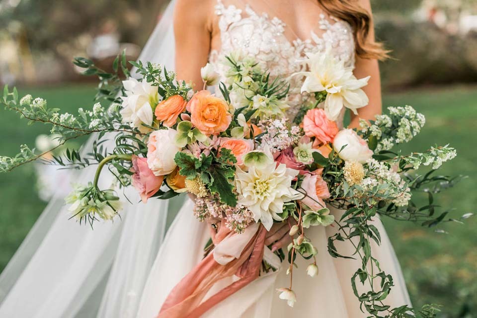 Wedding Budget Flowers | A bountiful bridal bouquet with dahlias and roses