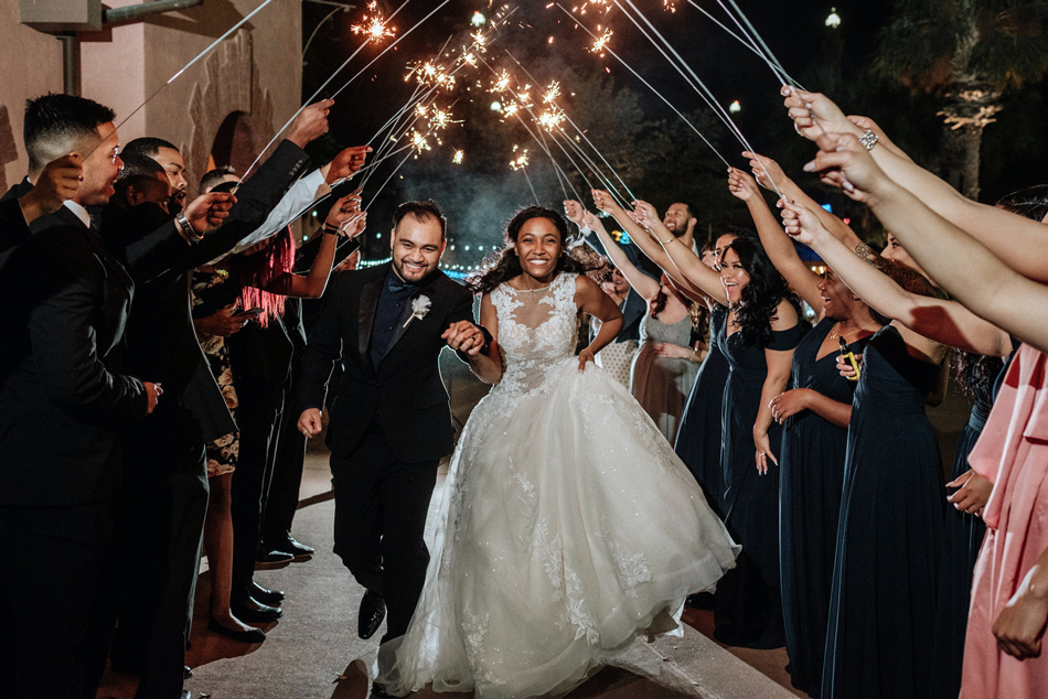 Sample Wedding Timeline | Cute newlyweds have their sparkler exit